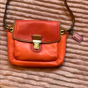 Orange Coach crossbody purse